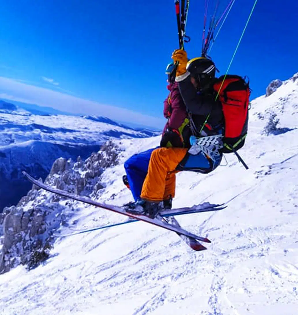 Paragliding take-off on skis from the snow at Gréolières-les-Neiges